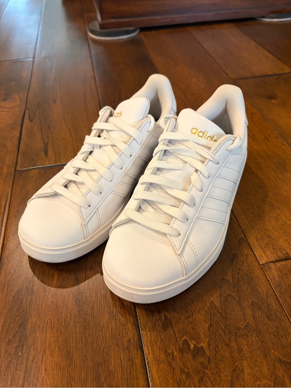 adidas White Low-Top Sneakers with Gold Logo Accents